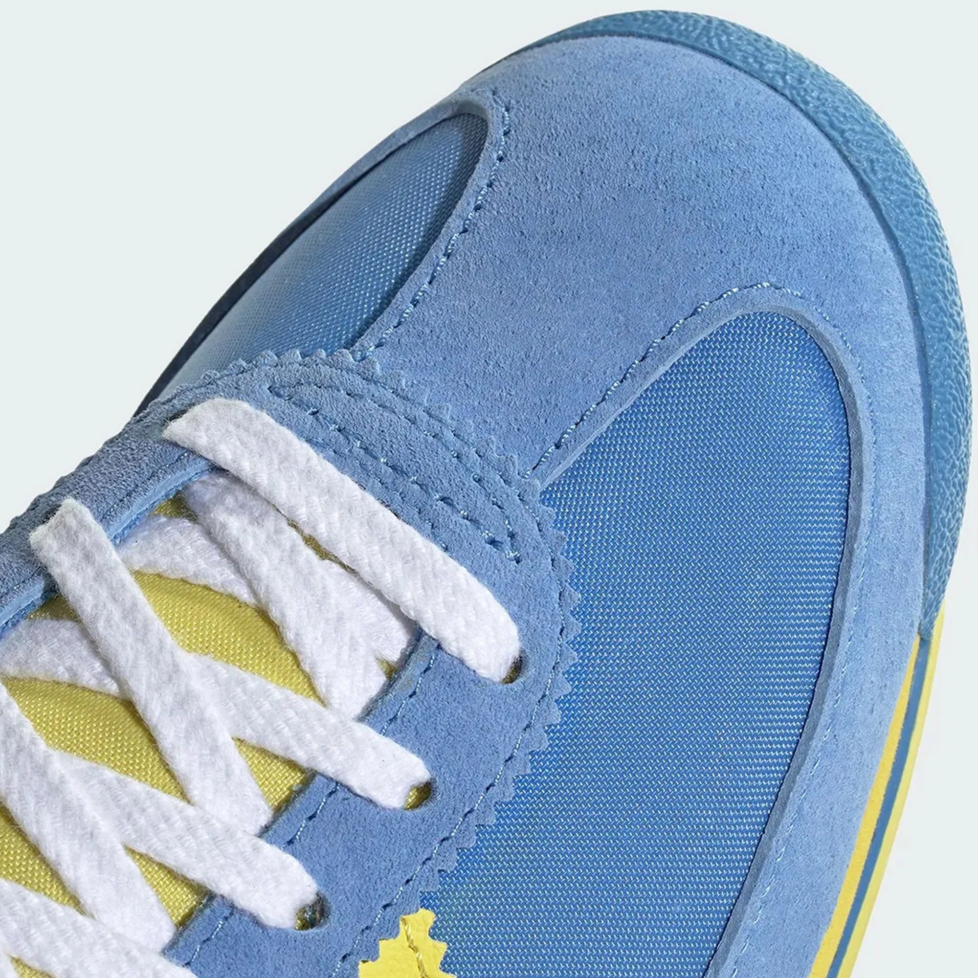 Adidas Mens SL72 Sporty & Rich Shoes running in a tundra area