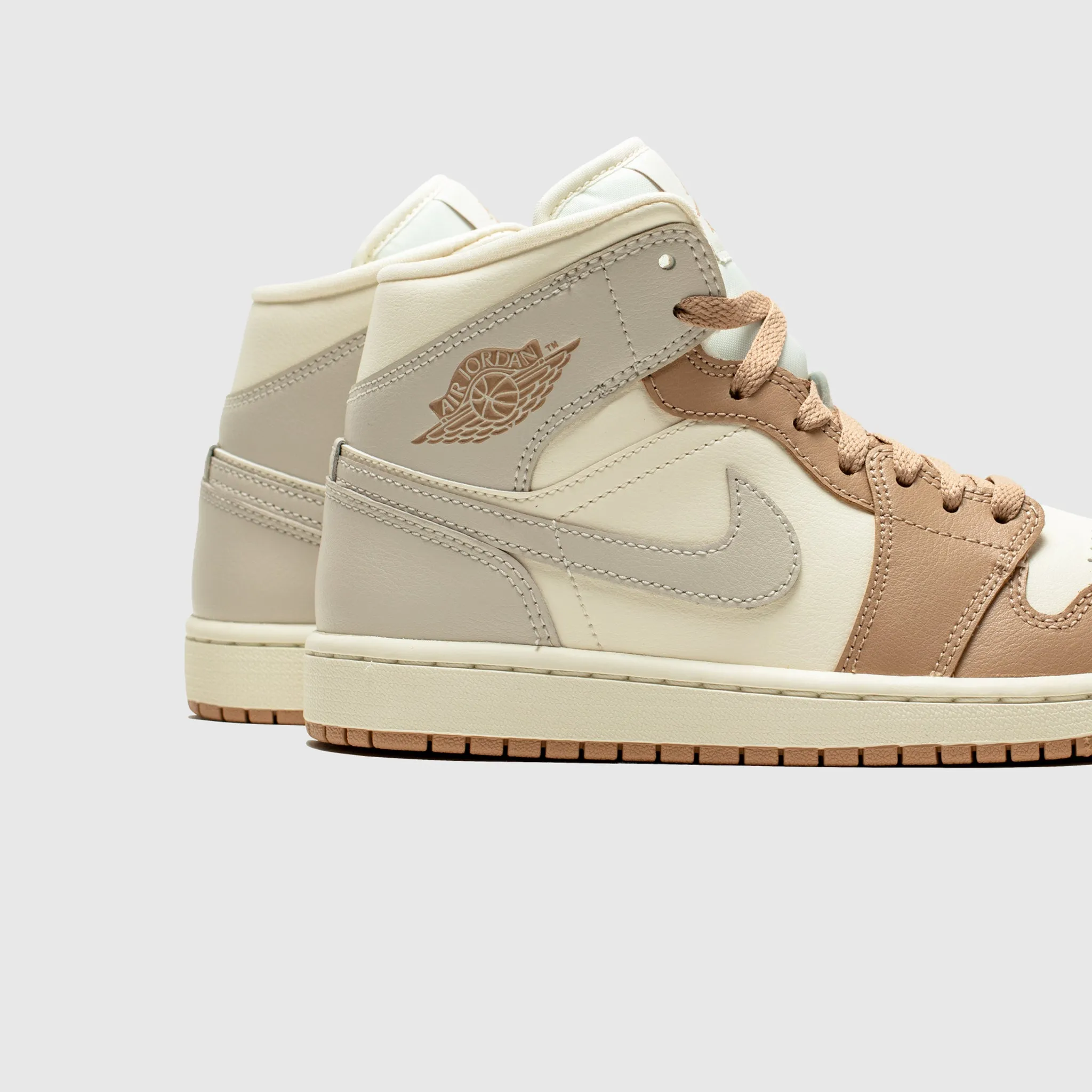 running with a slip - on design WMNS AIR JORDAN 1 MID "TAN TOE"