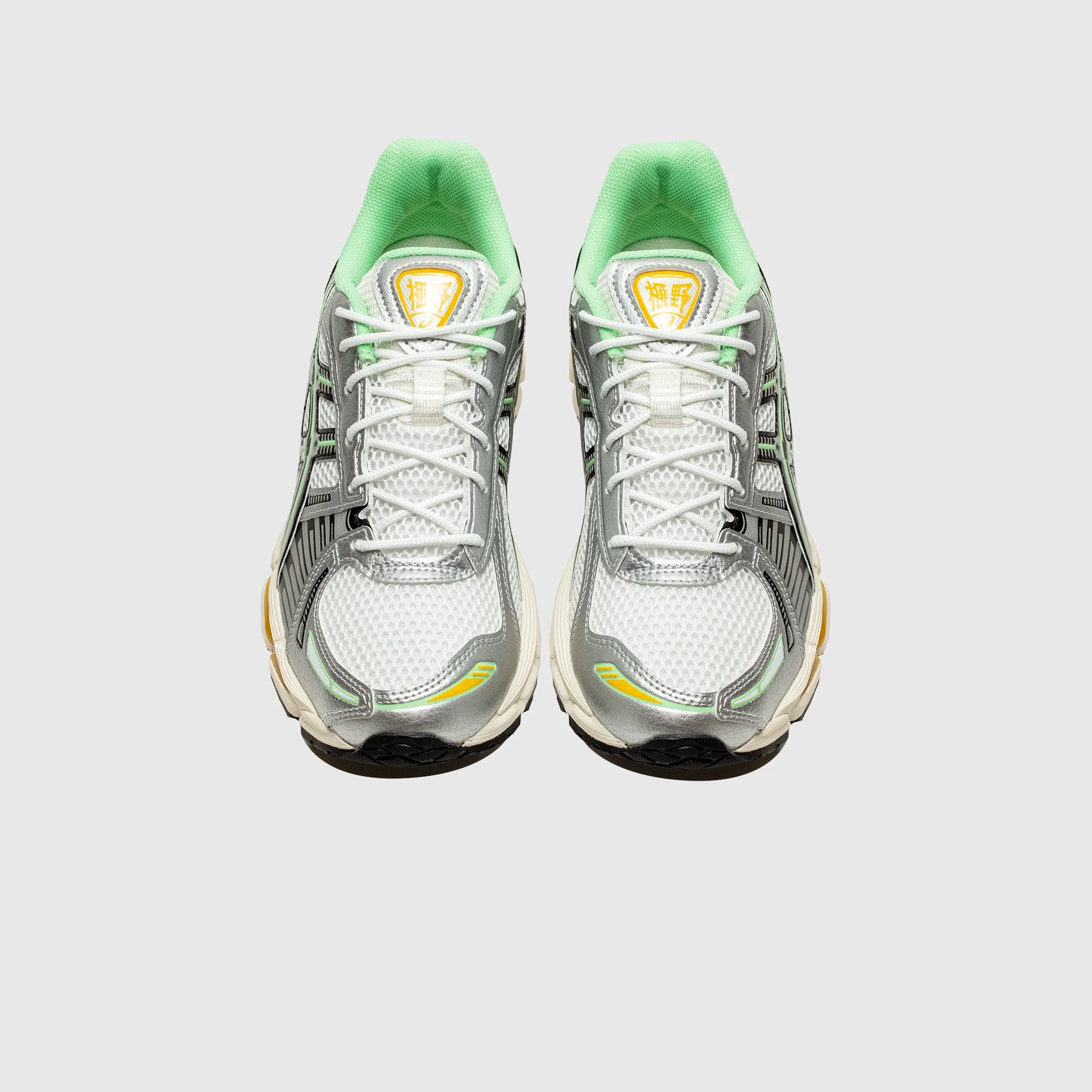 GEL-KAYANO 12.1 running with a lace - up closure running in banked tracks shoes