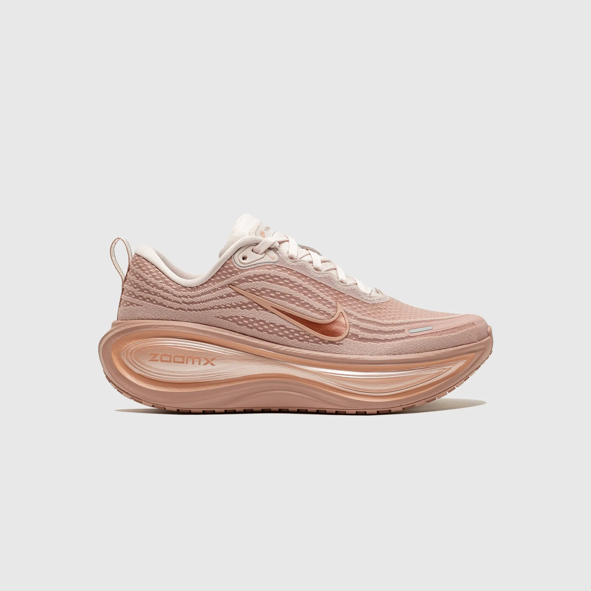 VOMERO PLUS "ROSE GOLD" Durable Build running in a tide pool area shoes