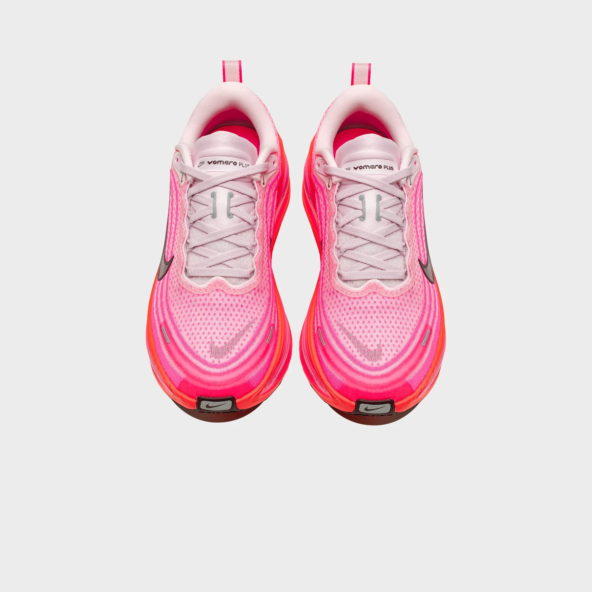 WMNS VOMERO PLUS "HYPER PINK" running in a neighborhood